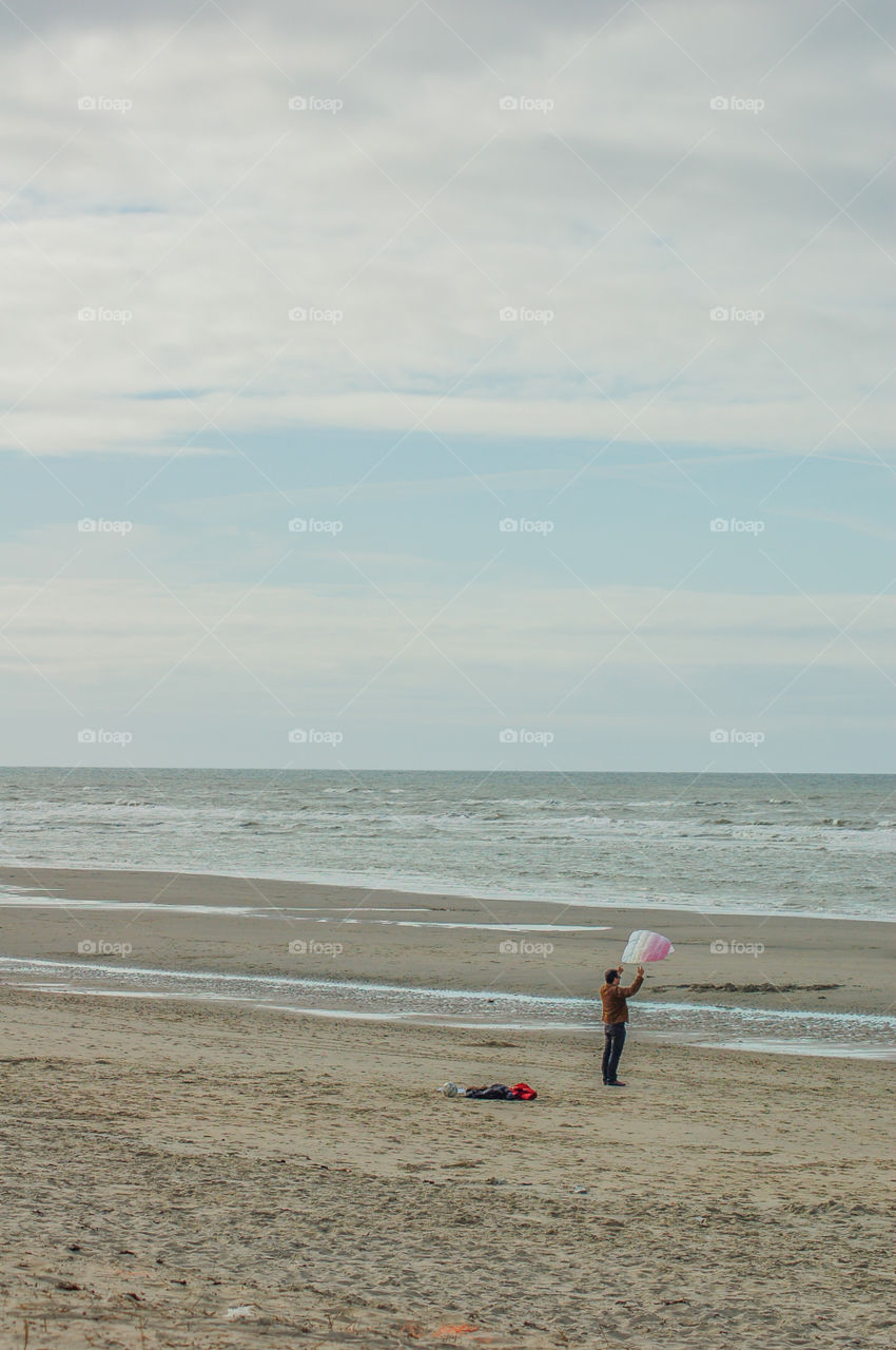 Man With Kite At The Beach Of Texel The Netherlands