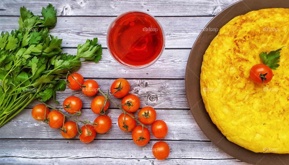 Spanish tortilla with tomatoes and parsley
