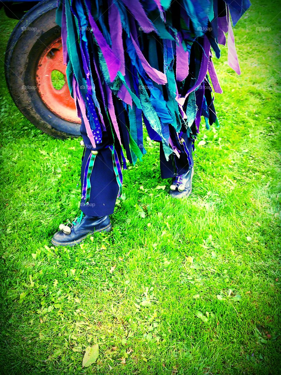 Male English Morris dancers colourful clothing with bells and  shoes 