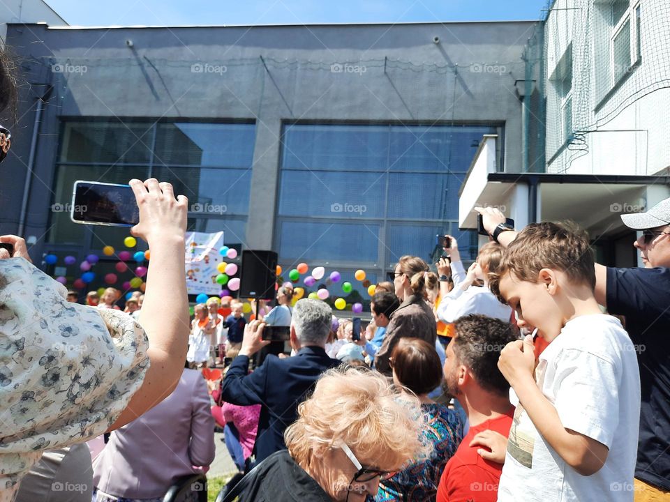 children day at school with crowds of parents