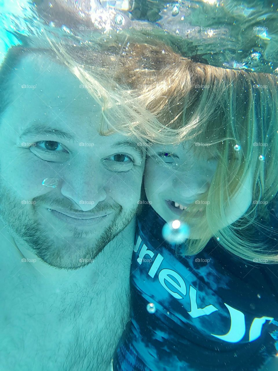 Dad and Daughter Underwater