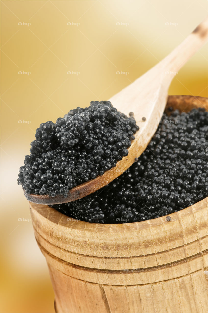 Caviar on wooden spoon