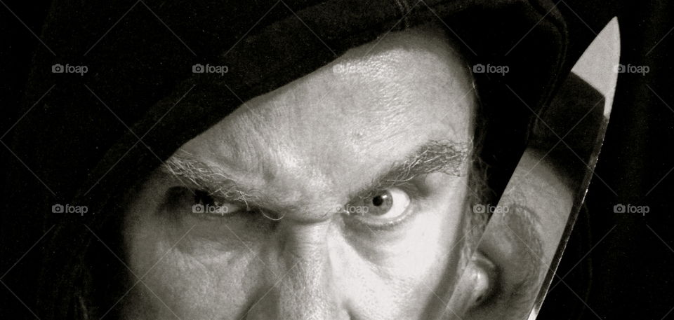 Extreme close-up of a man with knife