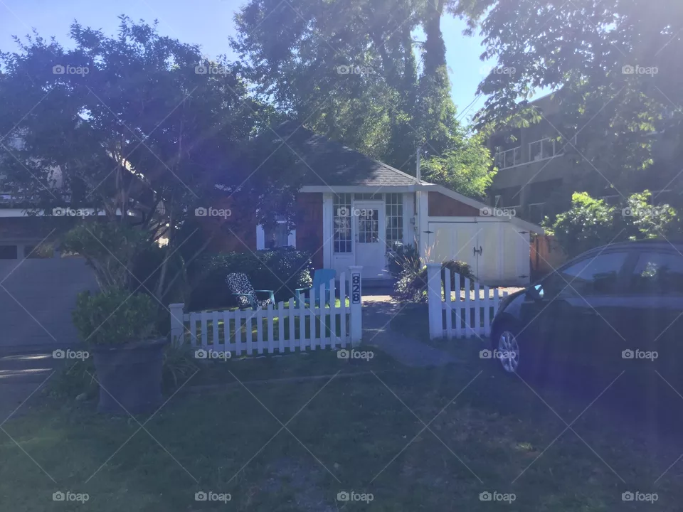 Little house with a white picket fence 