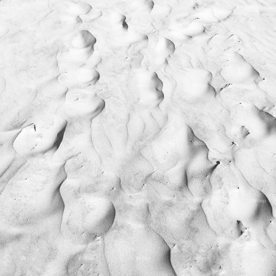 Patterns on wet beach sand 