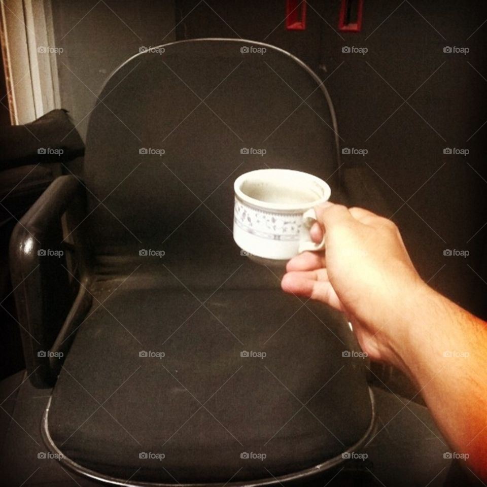 Empty cup for empty chair