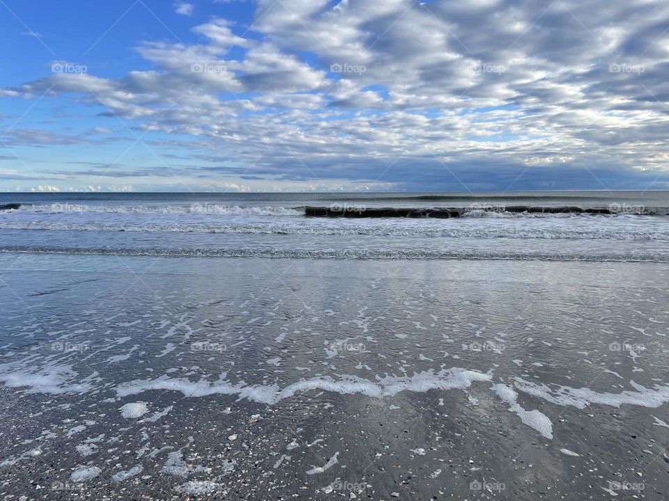 Sea foam and clouds