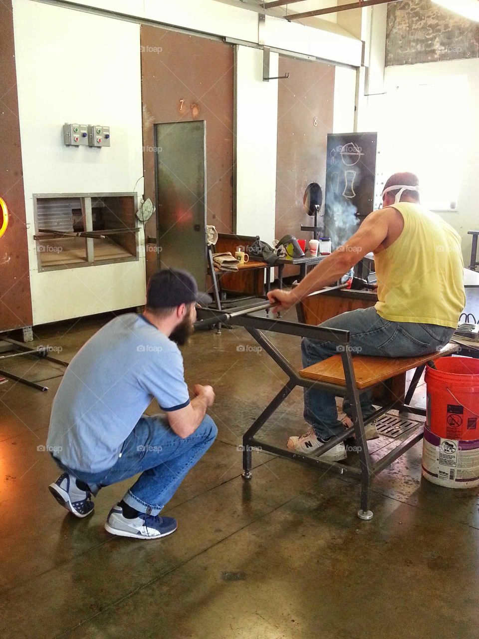 Teamwork in glass blowing