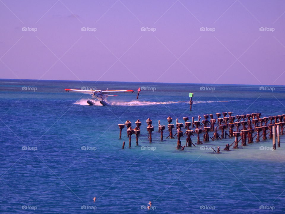 Seaplane taking off in Caribbean