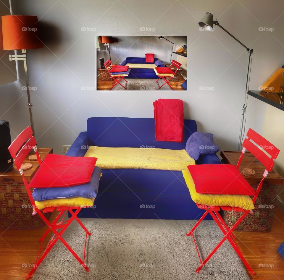 Room filled with primary colors and a picture of the room on the wall