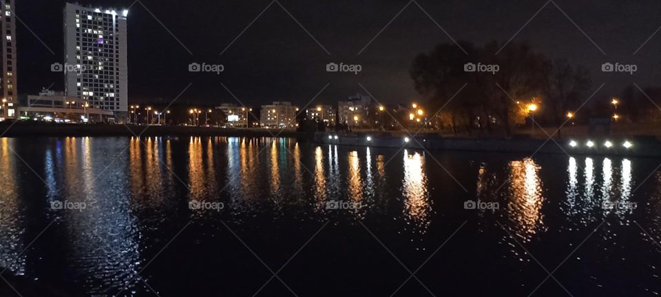 beautiful night light street view, windows magic light, cityscape and reflection in river