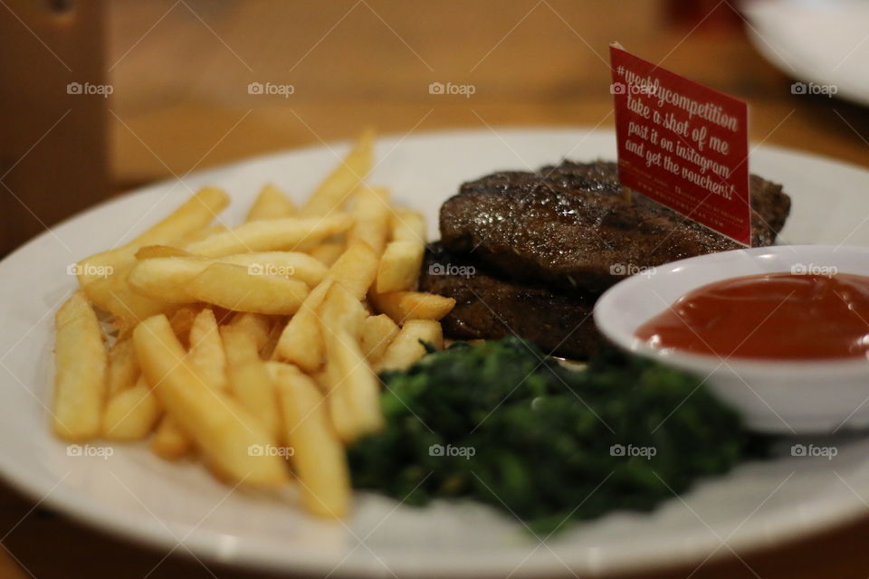 Steak served with French Fries