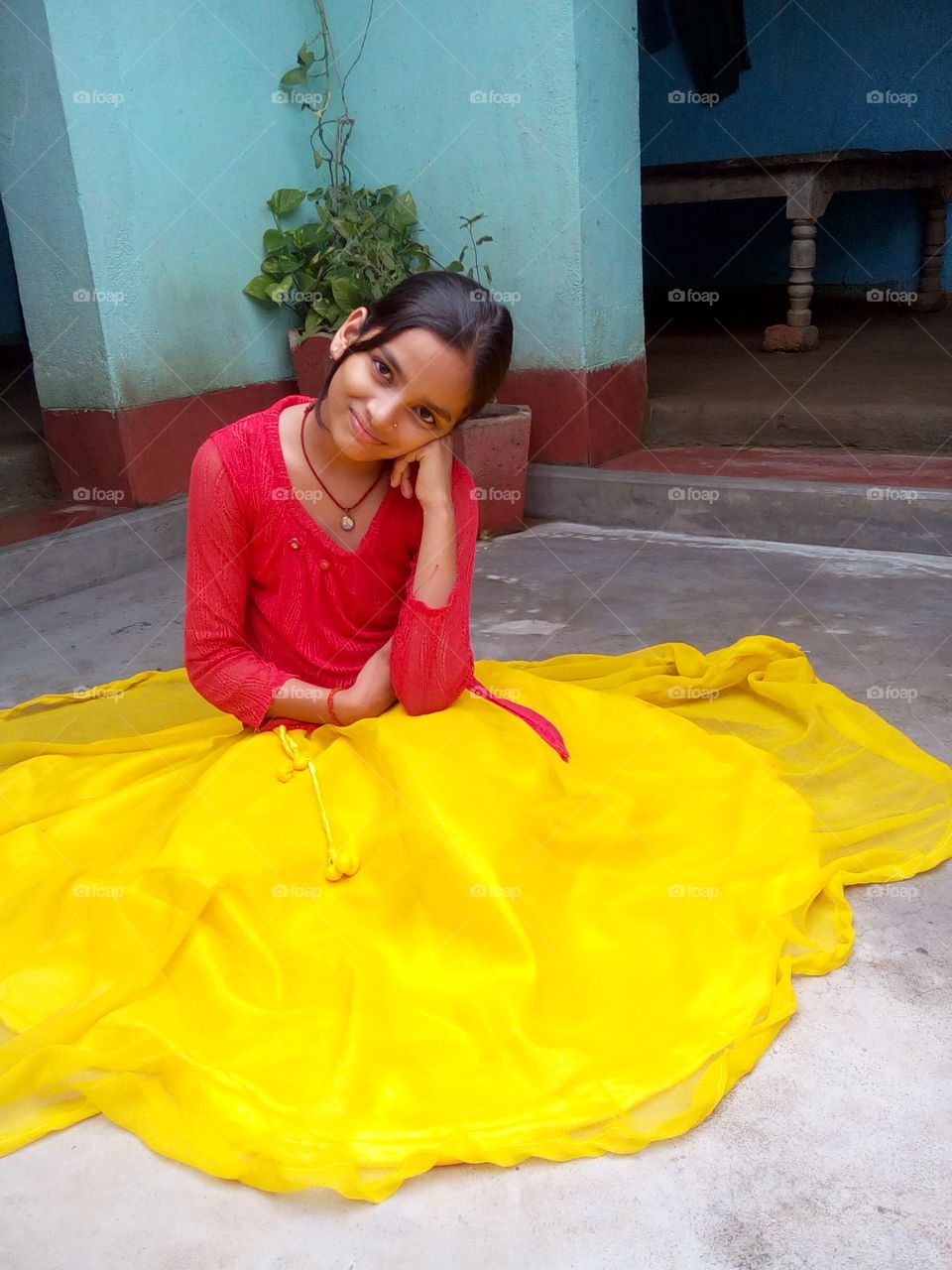 Portrait of happy indian girl posing