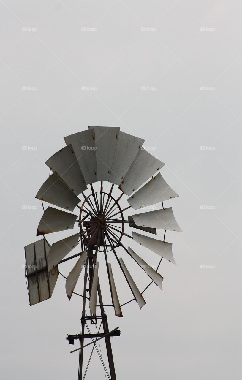 Circular shape of a windmill against cloudy sky