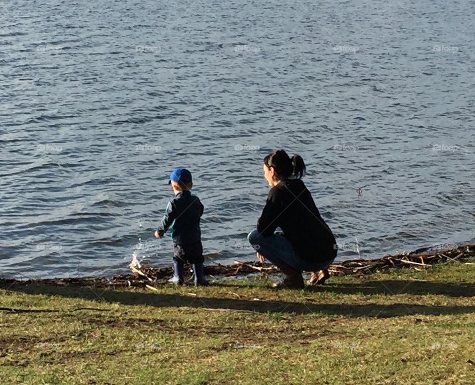 Woman and child by the water 