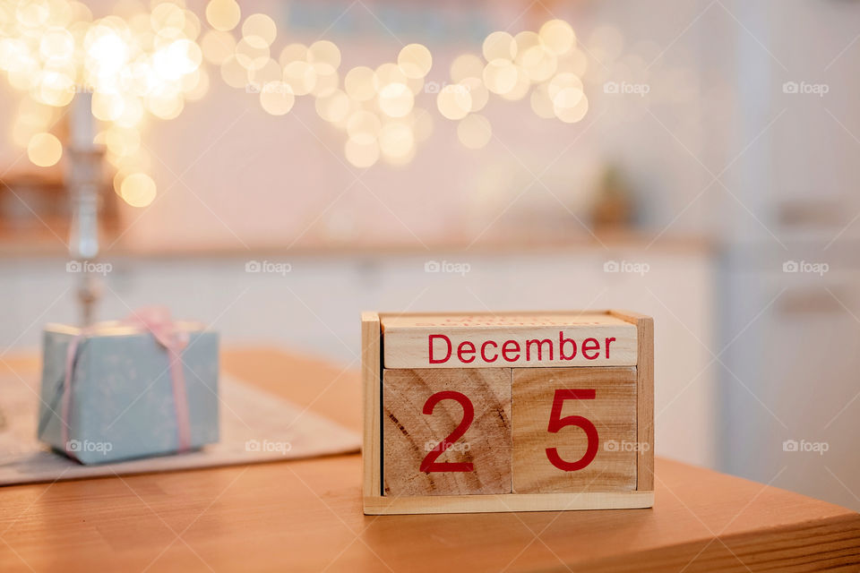 Christmas background with wooden block calendar with the date of December 25