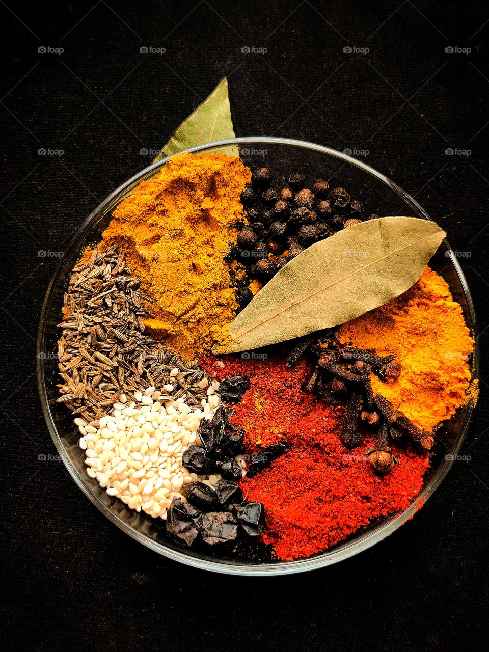 set of spices.  turmeric.  peppercorns.  saffron.  Carnation.  cumin.  sesame.  paprika.  Bay leaf