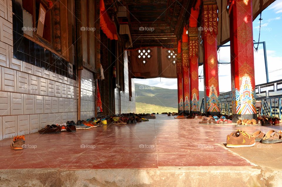 shoes in front of a Buddhist temple