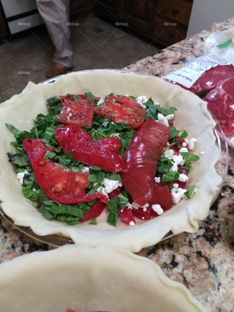 preparing tomato pie in the kitchen