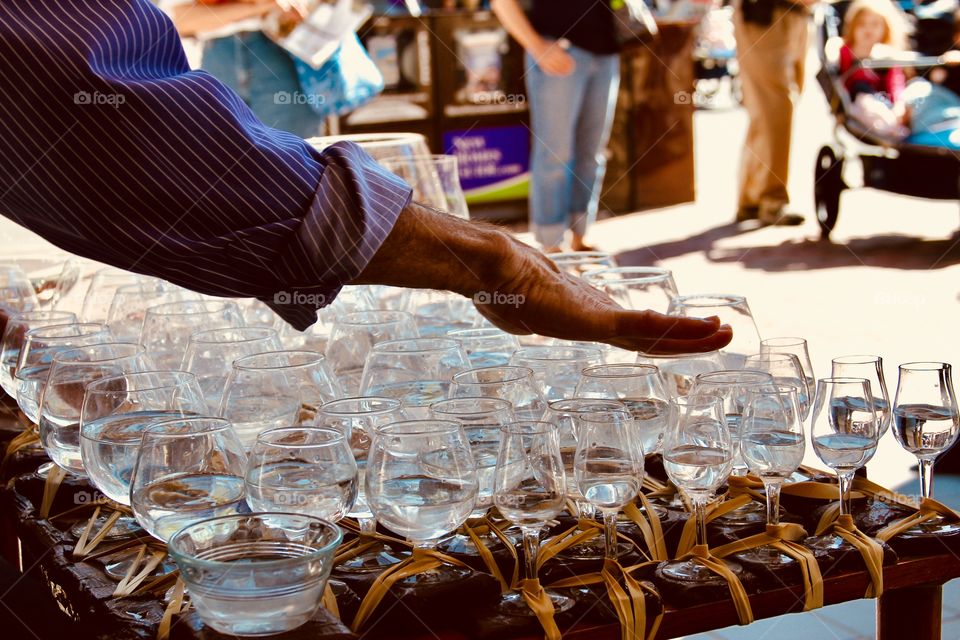 Street musician playing water glasses