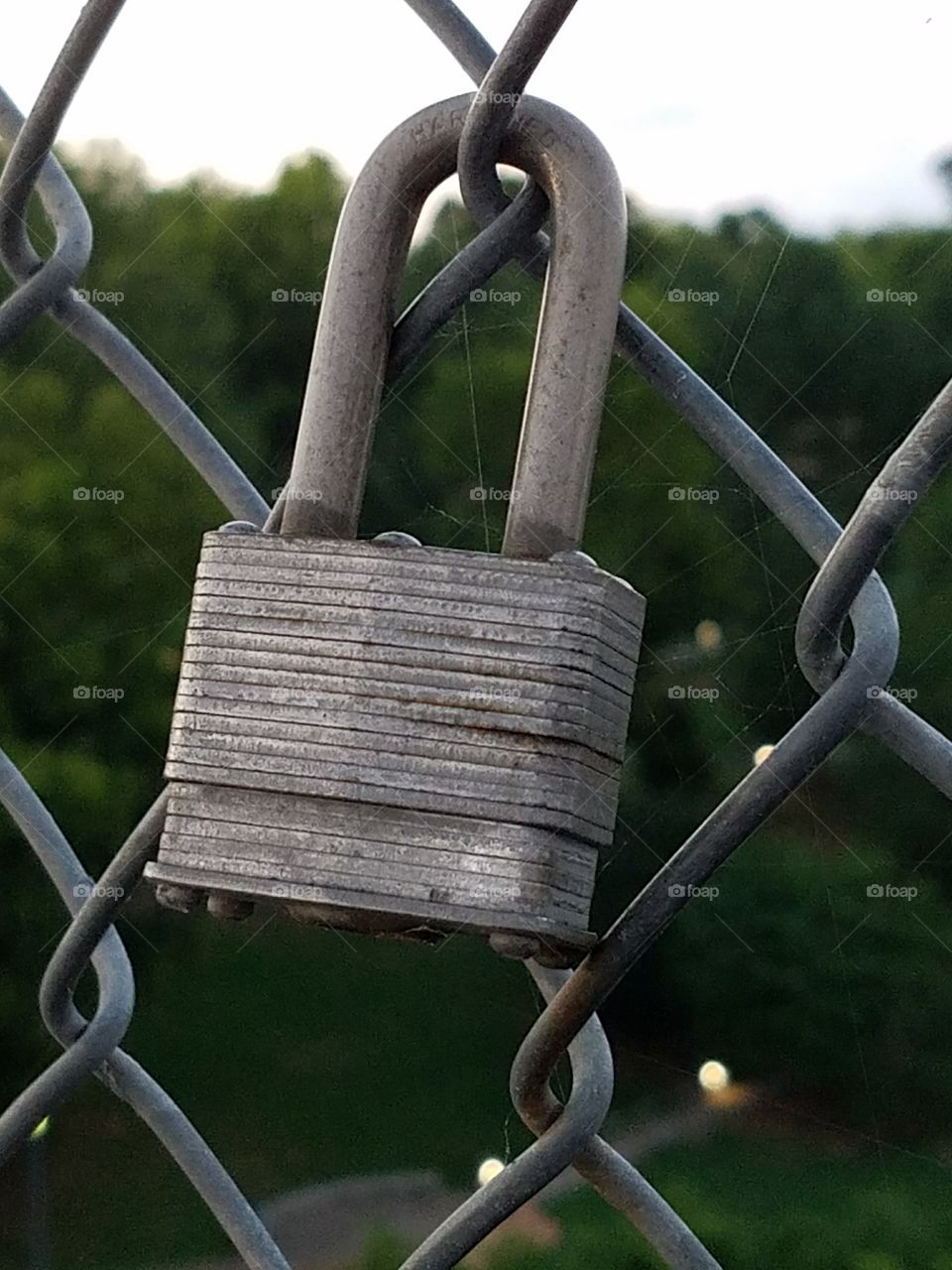 Padlock on Fence Above River