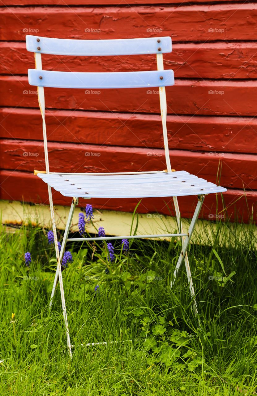 Close-up of empty chair in grass