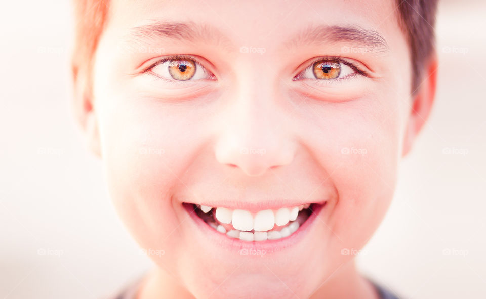 Portrait of smiling boy in warm sunset light