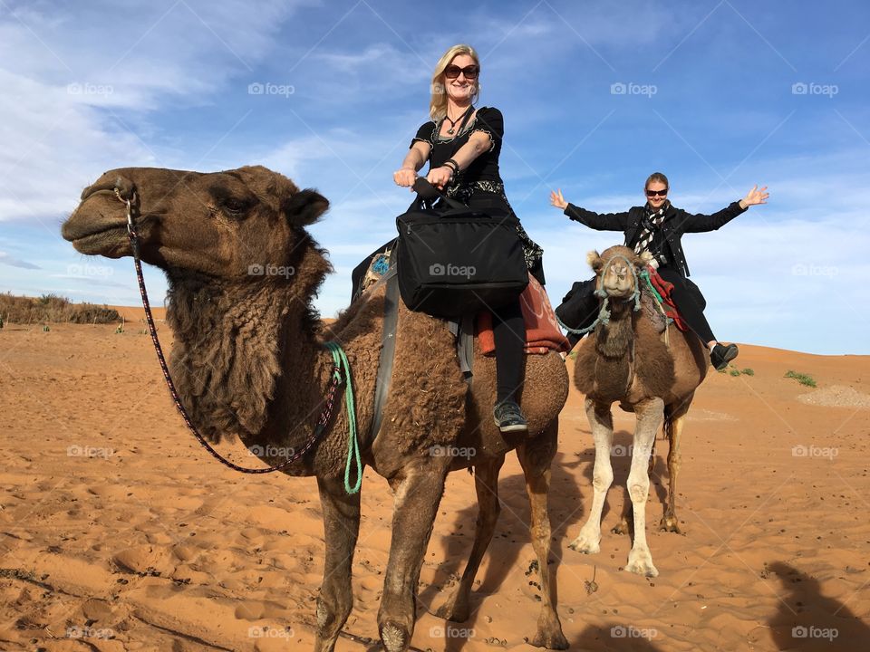 Woman enjoying ride on camel