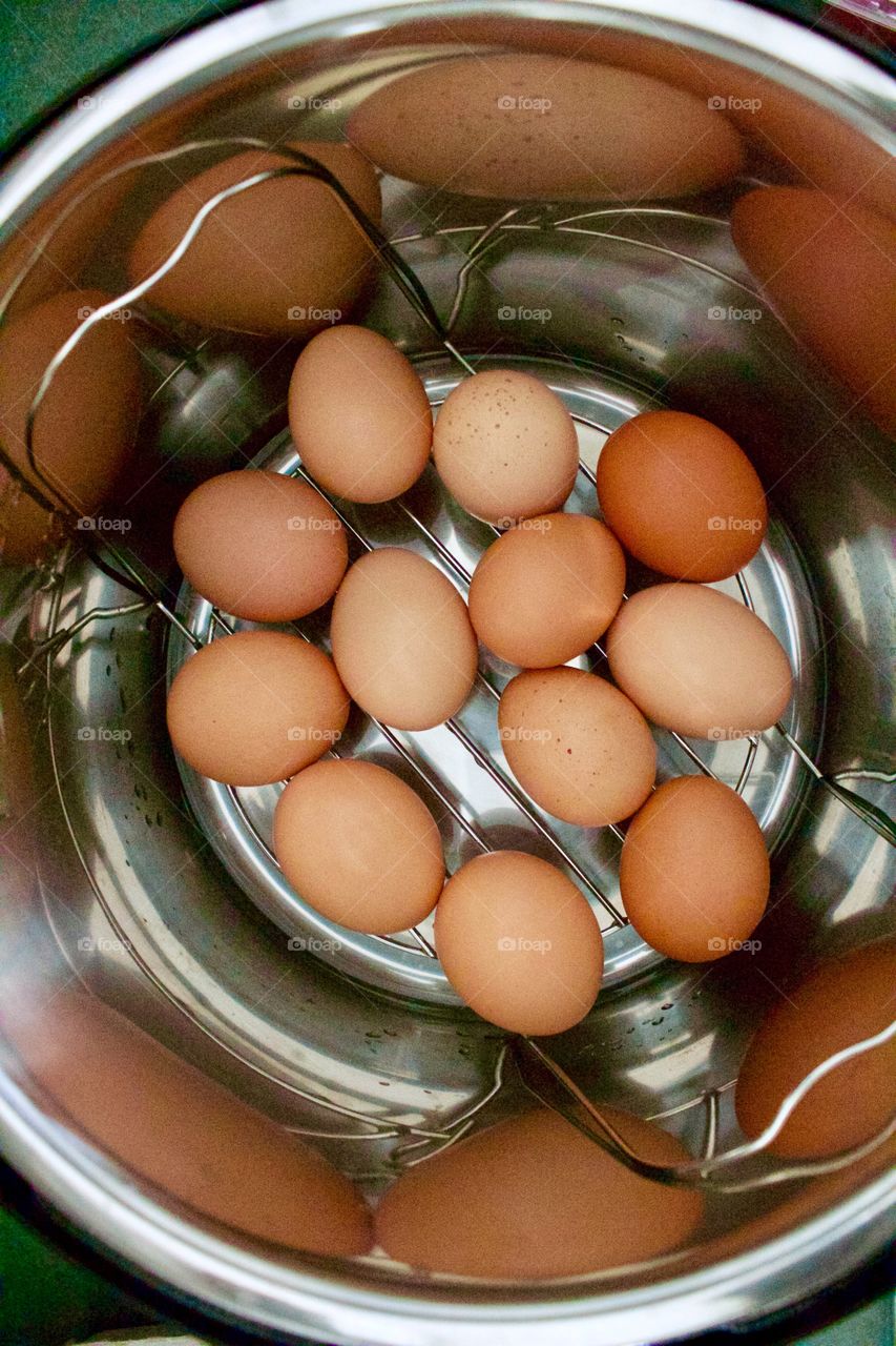 Farm fresh eggs on a trivet in an electric pressure cooker