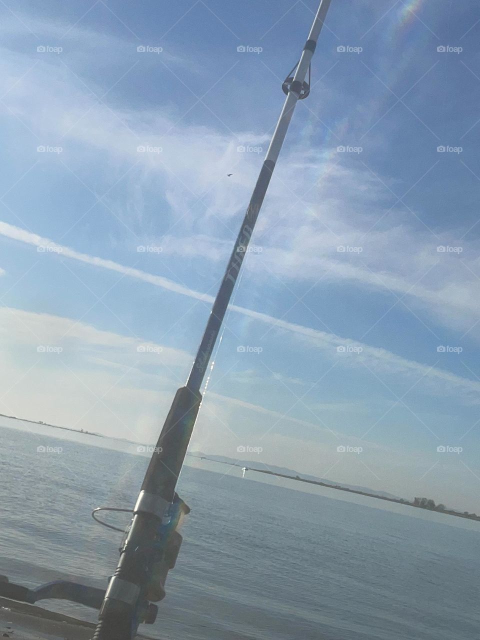 Feet in sand and my fishing pole 