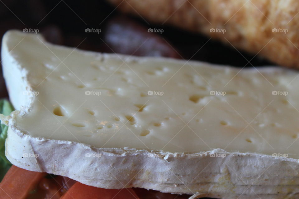 A closeup of a slice of some cheese from my breakfast. It was a locally made cheese that was something like Brie and Havarti together. yum 😋