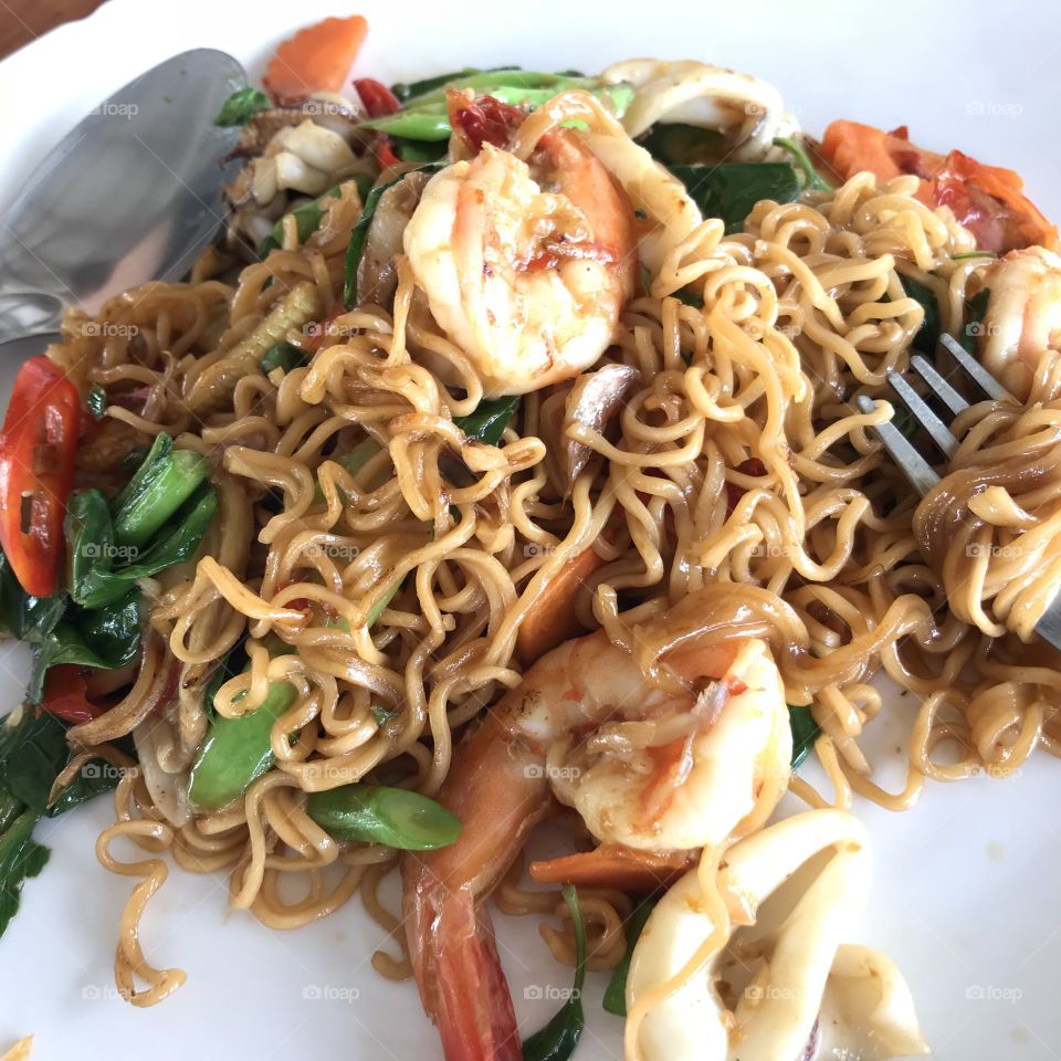 Instant noodles with fried stir spicy seafood