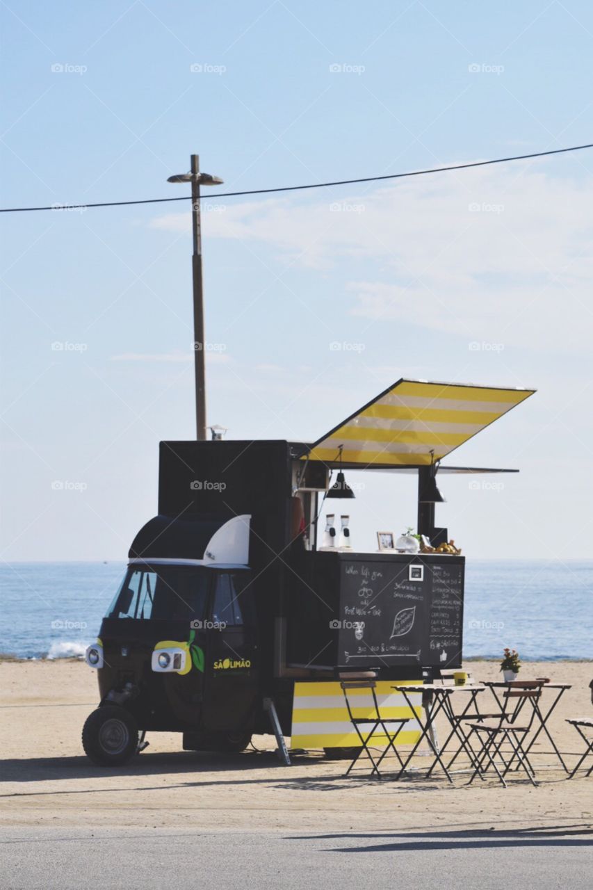 Street food vendor selling fresh lemonade made of organic lemon 