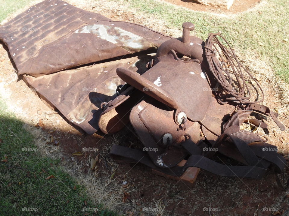iron saddle. This is a picture of some artwork that is on display in front of the local library in Graham Texas. 👣 🚶 🏃 🔥 💨