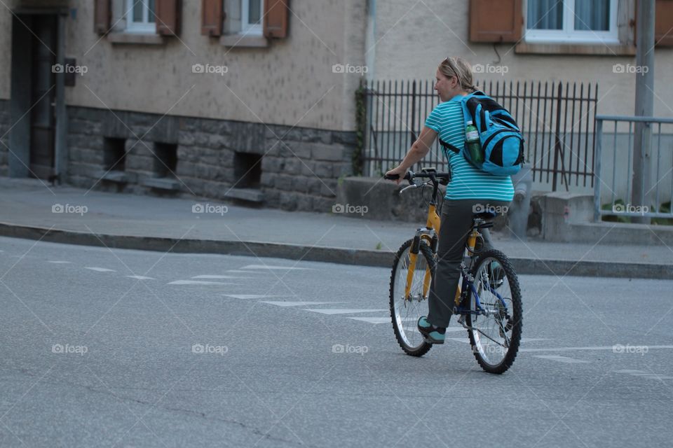 Woman On Bike. Woman riding her bike.