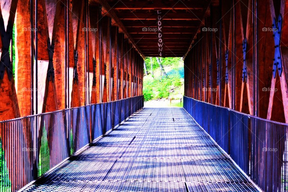 Covered Bridge in the Ozark Mountains. Perspective photo of a covered bridge