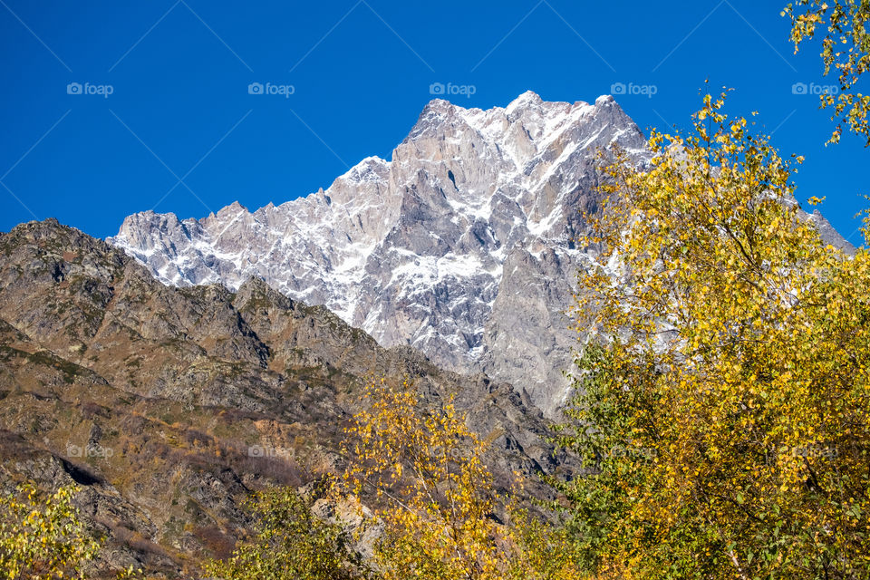 Beautiful landscape of autumn season on blue sky background in Georgia countryside