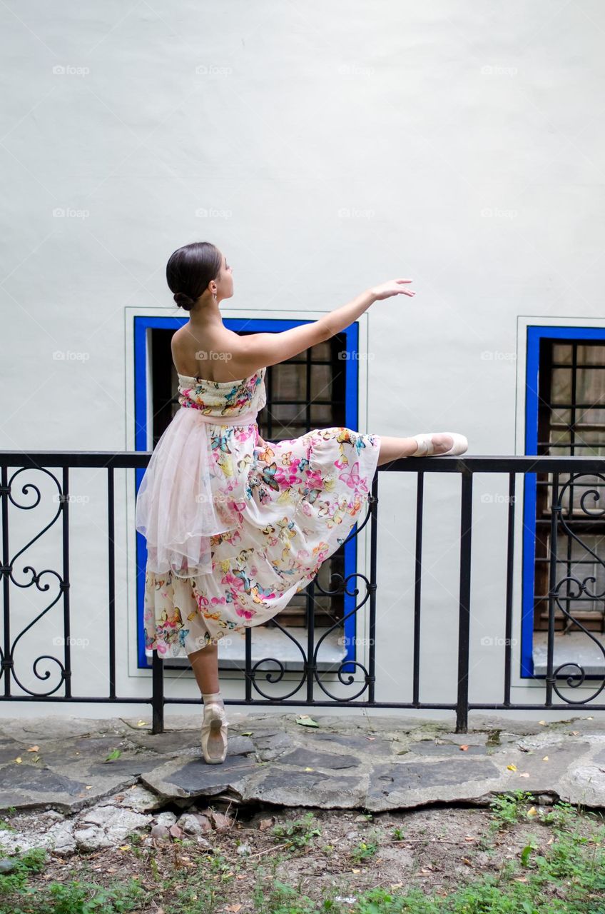 Young Female Ballerina Dancing Outside