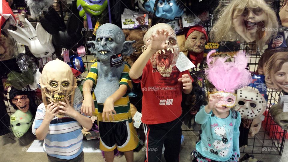 monsters. my kids at the Halloween store