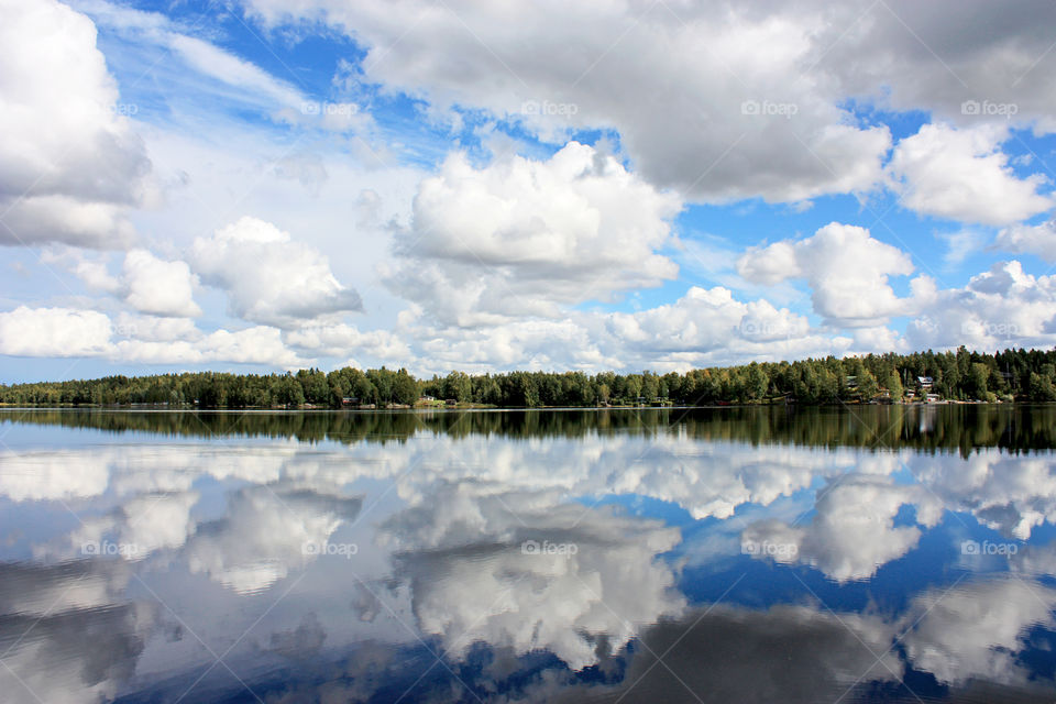 Sky and forest reflection on lake