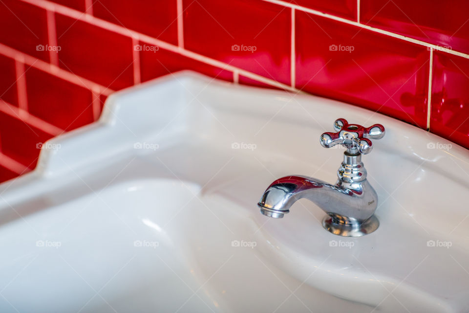 White Sink classic faucet red tile
