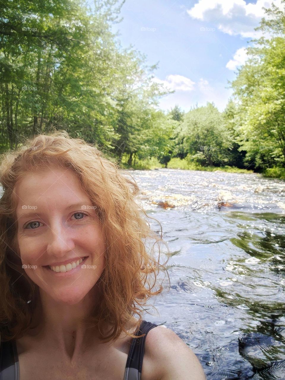 Selfie swimming at the river on a hot sunny day.