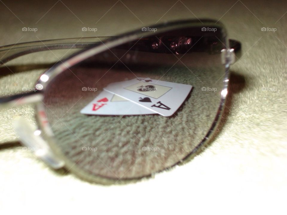 Poker in reflection of sunglasses
