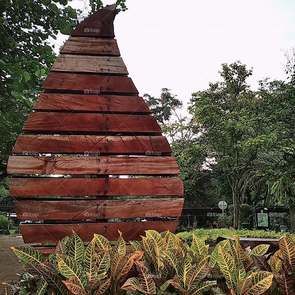 Signboard in the park, with chair and plants