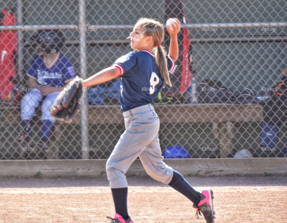 Girl Playing Little League Baseball