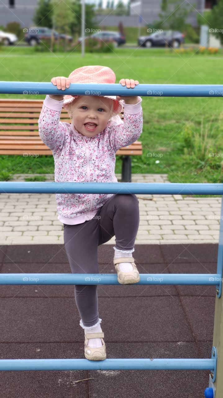 Kids playground Girl climbing