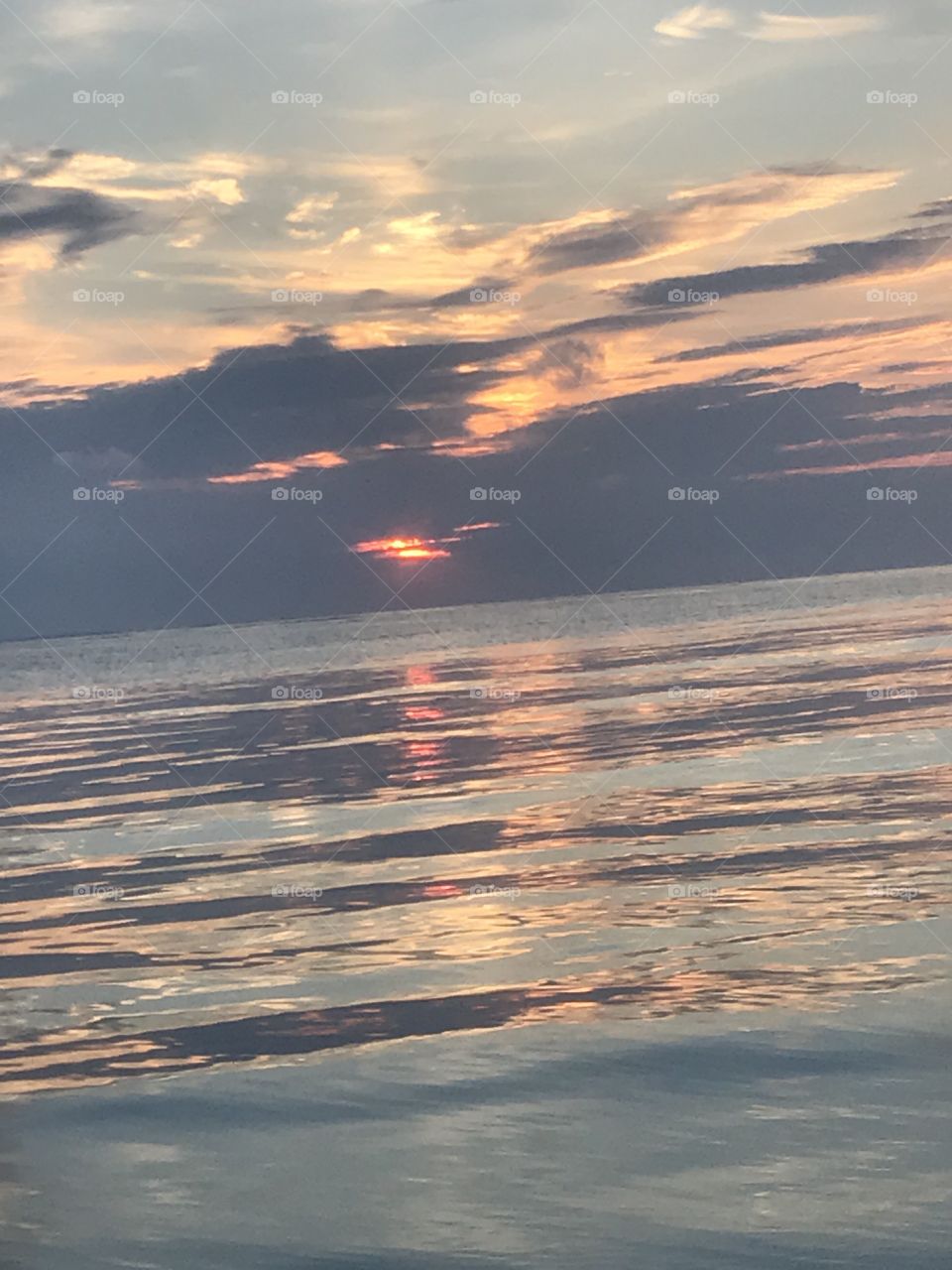 Sun rising in the ocean 