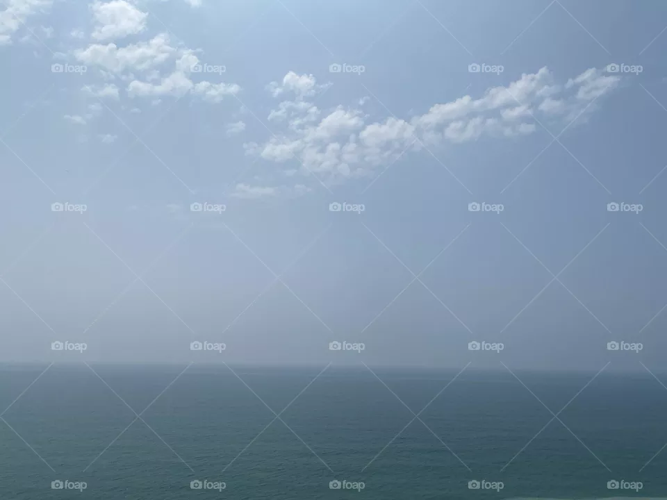 Looking out at the ocean and listening to the waves come in 