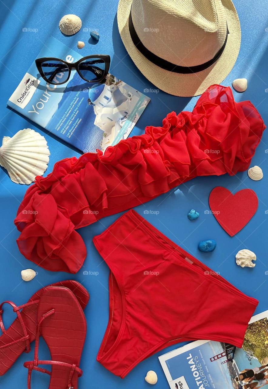 Holiday mood, travel time, summer outfit, red bikini. Ready to travel.
