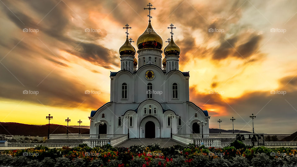 Holy Trinity Church in the city of Petropavlovsk-Kamchatsky at dawn, the sky is colored by the light of sunrise